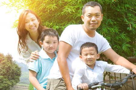 Asian family enjoy cyclingの写真素材
