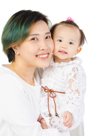 Indoor portrait of asian woman and her babyの写真素材