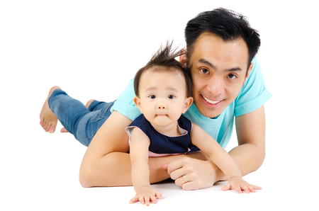 Indoor portrait of asian man and his daughterの写真素材