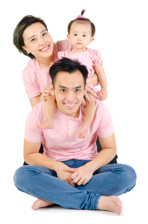 Indoor portrait of beautiful asian familyの写真素材
