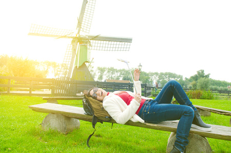 Asian woman enjoyed her holiday in Zaanse Schans, Netherlandsの写真素材