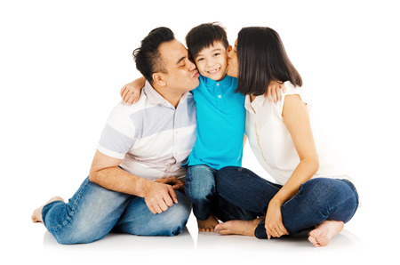 portrait of asian family, kissing their childの写真素材