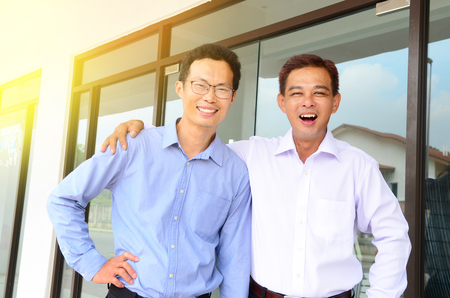 Asian businessmen looking at camera and smileの写真素材