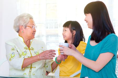 Asian senior woman and grandchildrenの写真素材