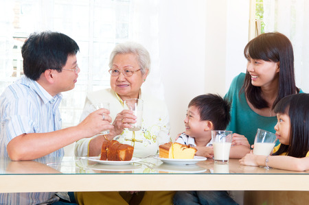 Asian three generations having breakfastの写真素材