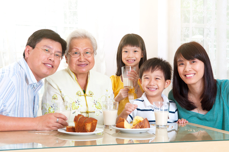 Asian three generations family enjoyed tea timeの写真素材