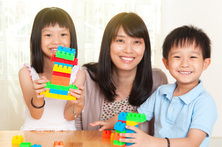 Asian kids playing building blocksの写真素材