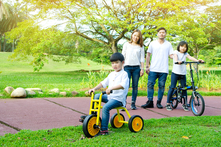 Asian family enjoyed outdoor activity in the parkの写真素材