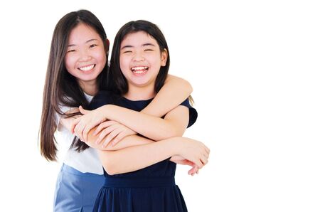 Portrait of two happy asian girlsの写真素材