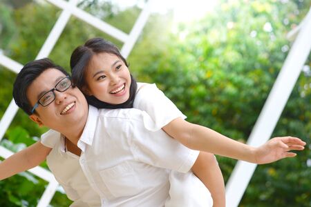 Asian man piggyback his grifriendの写真素材
