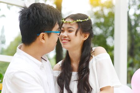 Asian young couple looking at each otherの写真素材