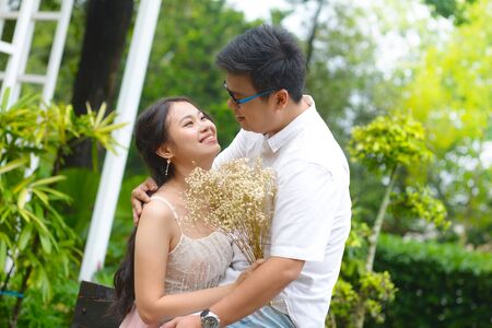 Asian young couple dating at the parkの写真素材