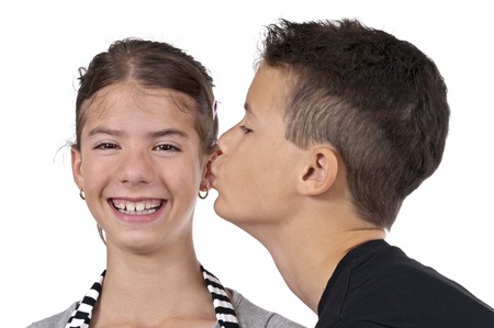 Boy kissing girl beauty on studio shotの写真素材