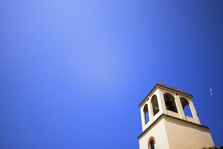 Church tower detail at sunny day with clear blue skyの写真素材
