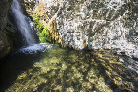 Millomeris Waterfalls with long exposure at sunny dayの写真素材