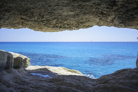 Sea caves in the high cliffs at south-east corner of Cyprusの写真素材