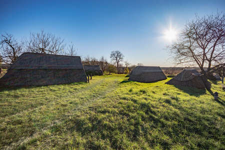 Old wine cellars of Ocsa made from reed at sunset backlight, Hungaryの写真素材