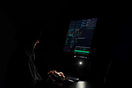 Hacker coding at night cybersecurity conceptの写真素材