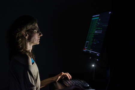 Hacker coding at night cybersecurity concept