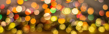 Colorful background with defocused lights. Bokeh background. Christmas background with light spots...