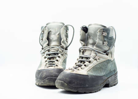 Old mountain boots isolated on a white background.の写真素材