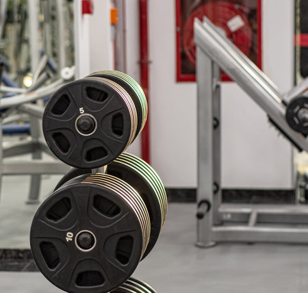 Rows of dumbbells in the gym .Modern equipment in gym .Rack with different dumbbells in gym, closeupの写真素材
