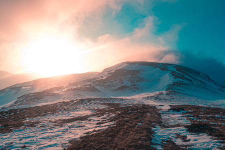 A beautiful sunrise in the winter mountains.の写真素材
