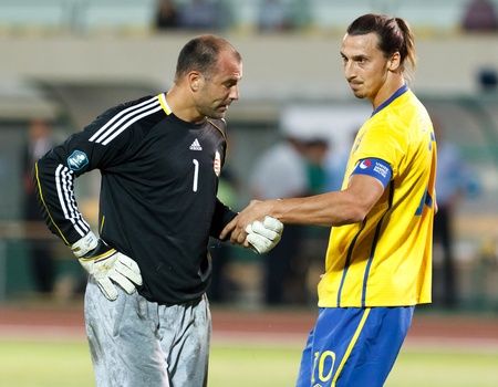 BUDAPEST - SEPTEMBER 2: Hungarian Gabor Kiraly (L) and Swedish Zlatan Ibrahimovic during Hungary vs. Sweden (2:1) UEFA Euro 2012 qualifying game at Puskas Stadium on September 2, 2011 in Budapest, Hungary.のeditorial素材