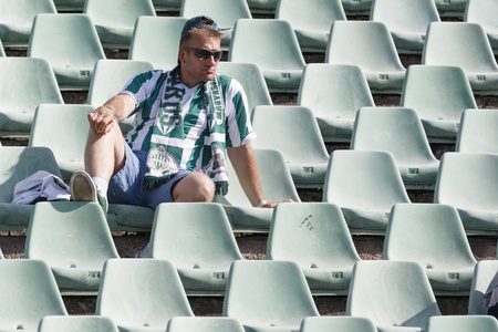 BUDAPEST - AUGUST 4  A lonely unidentified fun of FTC during FTC vs  Videoton OTP Bank League football match at Puskas Stadium on August 4, 2013 in Budapest, Hungary のeditorial素材