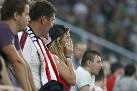 BUDAPEST, HUNGARY - SEPTEMBER 7, 2014: Disappointed Hungarian fan cries during Hungary vs. Northern Ireland UEFA Euro 2016 qualifier football match at Groupama Arena on September 7, 2014 in Budapest, Hungary.のeditorial素材