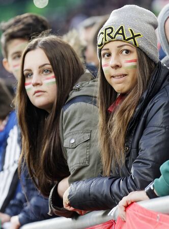 BUDAPEST, HUNGARY - MARCH 26, 2016: Hungarian fan girls during Hungary vs. Croatia international friendly football match in Groupama Arena.のeditorial素材