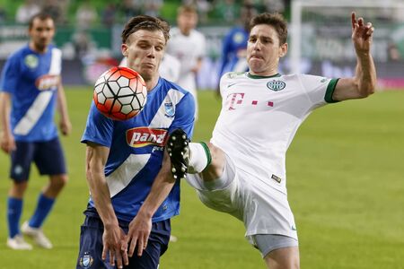 BUDAPEST, HUNGARY - APRIL 16, 2016: Zoltan Gera of Ferencvaros (r) fights for the ball with Daniel Gera of MTK Budapest during Ferencvaros - MTK Budapest OTP Bank League football match at Groupama Arena.のeditorial素材