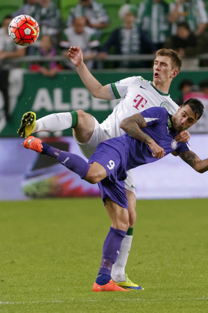 BUDAPEST, HUNGARY - APRIL 23, 2016: Michal Nalepa of Ferencvaros (l) duels for the ball with Laszlo Lencse of Ujpest during Ferencvaros - Ujpest OTP Bank League football match at Groupama Arena.のeditorial素材