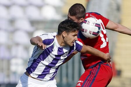 BUDAPEST, HUNGARY - APRIL 30, 2016: Akos Kecskes of Ujpest (l) battles for the ball in the air with Patrik Tischler of Videoton during Ujpest - Videoton OTP Bank League football match at Szusza Stadium.のeditorial素材