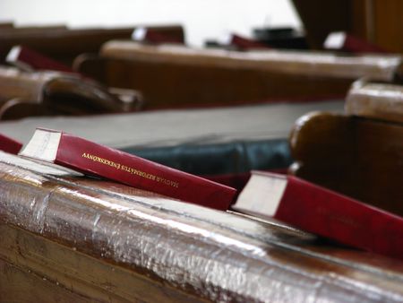 protestant church desk with bibles on it