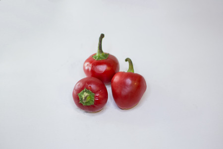 Three chillies on white backgroundの写真素材