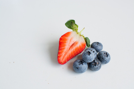 Blueberry and strawberry berries fruit isolated on a white backgroundの写真素材