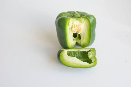 Colorful capsicum bell pepper sliced and whole isolated on white backgroundの写真素材