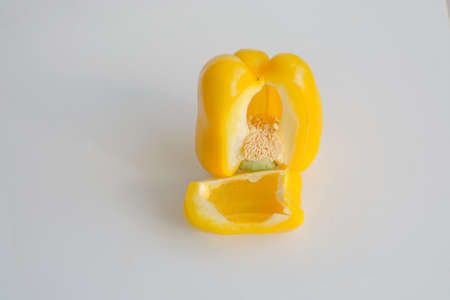 Colorful capsicum bell pepper sliced and whole isolated on white background