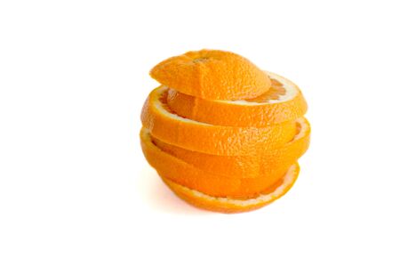 Orange sliced and stacked back together isolated on whiteの写真素材