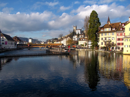 21 December 2012: Lucerne / Luzern, Switzerland. Buildings reflecting in the Reuss river.のeditorial素材