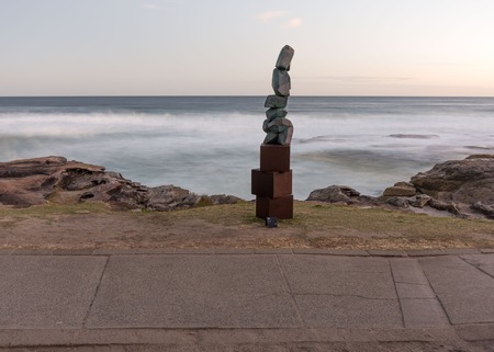 5th of November 2016, Bondi Beach, Sydney, Australia. Sculpture titled Stack by Clara Hali with the motion-blurred sea in the background at Sculpture by the Sea at sunsetのeditorial素材