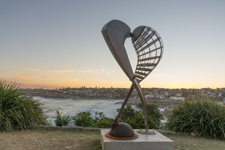 5th of November 2016, Bondi Beach, Sydney, Australia. Geoffrey Bartlett Embrace sculpture against the sunset at Sculpture by the Sea. Free annual eventのeditorial素材