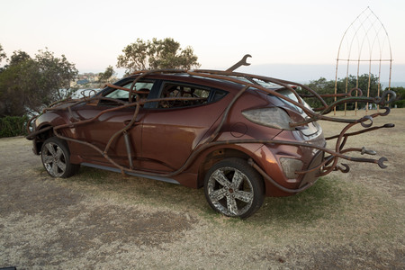 5 November 2013: Bondi Beach, Sydney, Australia - Car wrapped in metal at Sculpture by the Sea free outdoor event, the largest of its kind in the Southern Hemisphere.のeditorial素材