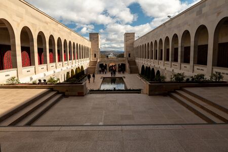 Canberra, ACT, Australia - Sept 1 2018: poppy decoration next to the wall of fallen soldiers at the Australian War Memorial - Lest we forget, Remembrance of war losses.のeditorial素材