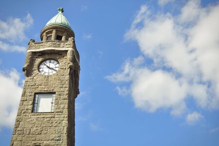 The tower at the St. Pauli-Landungsbrücken in front of the blue sky in the afternoon sunの写真素材