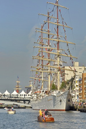 Port Amsterdam, Amsterdam, the Netherlands - August 20, 2015: The Dar Mlodziezy tall ship docked in...