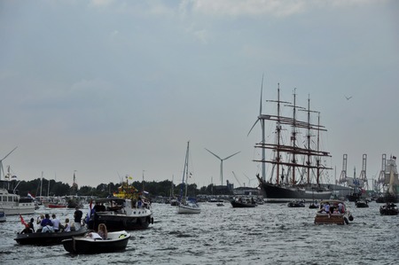 Ij River, Amsterdam, the Netherlands - August 19, 2015: long distance view of the Sedov tall ship Russia among small spectator boats on the Ij river approaching the port of Amsterdam on the 1st day of the SAIL 2015 www.sail.nl, an international public nauのeditorial素材