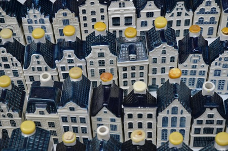 Amsterdam, Netherlands - May 21, 2016: White KLM pottery canal houses at the weekend flee market on the Northern Market (Noordermarkt), in the Jordaan district.のeditorial素材