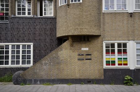 Amsterdam, Netherlands - May 21, 2016: Side view of a residential entrance in Amsterdam School architecture style, on the Zaanstraat in the Spaarndammerbuurt district.のeditorial素材